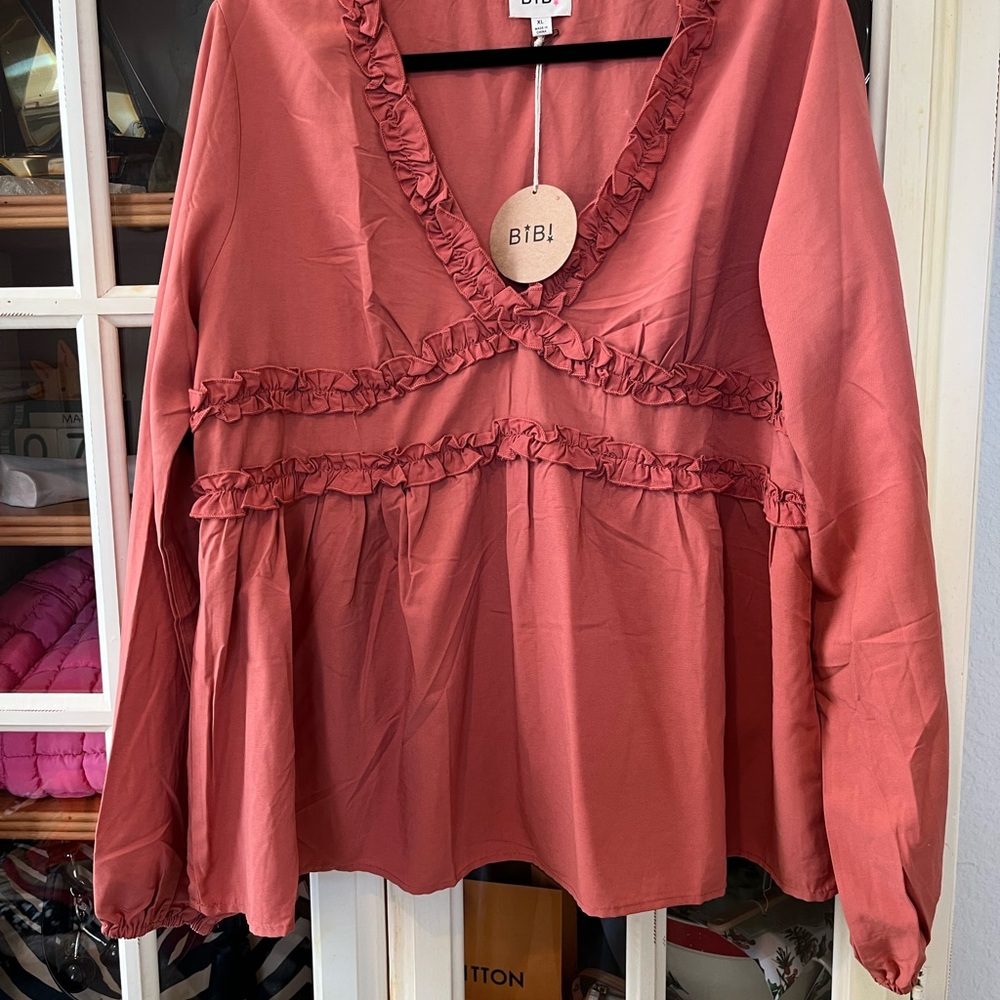 BiBi dusty rose ruffled V-neck peplum tunic